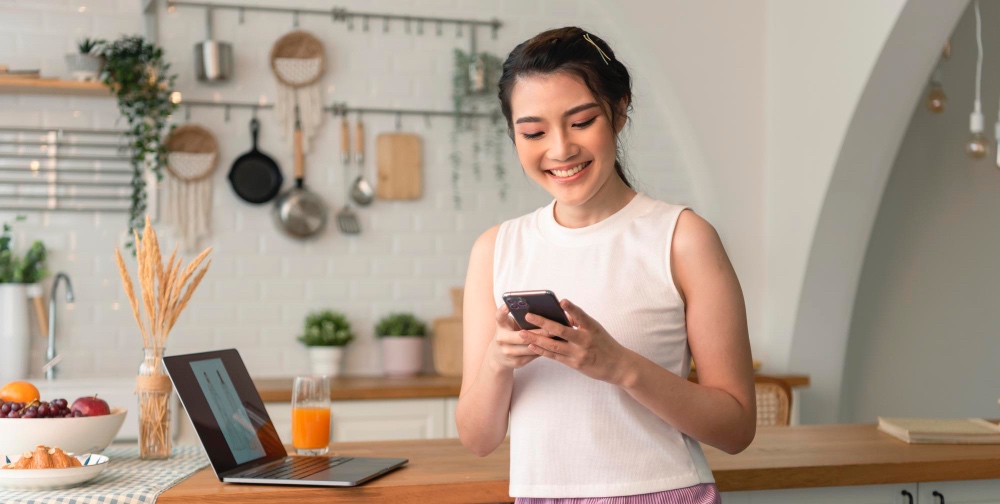 Woman using her phone to book a Tasker.